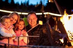 Firepits and S'mores Noerthstar Village Family Eating Roasting S'mores